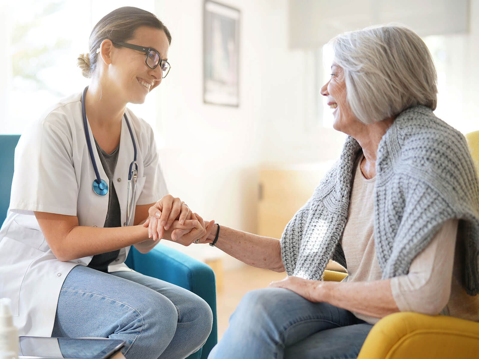 healthcare professional visiting a patient in their home providing comfort and healing